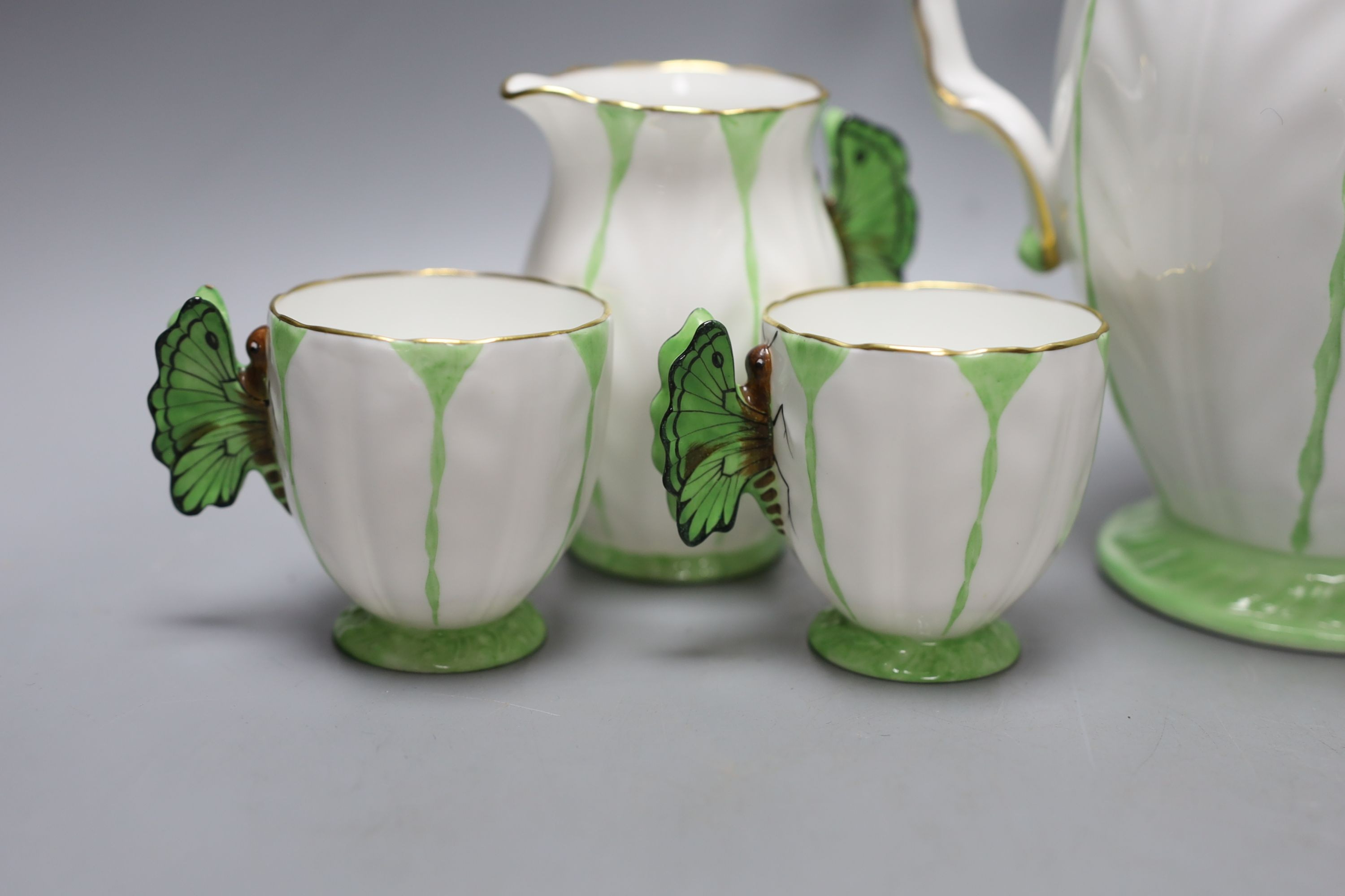 An Aynsley green and white butterfly handled part tea service